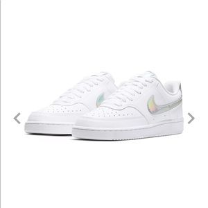 White nikes with silver swoosh
